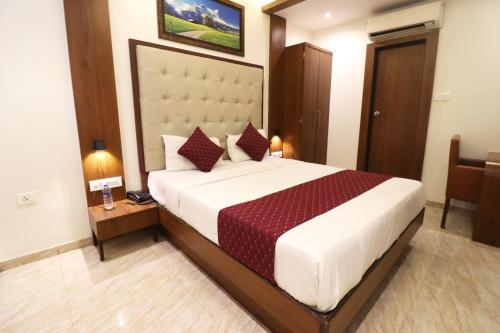 Ένα ή περισσότερα κρεβάτια σε δωμάτιο στο GATEWAY STAR HOTEL