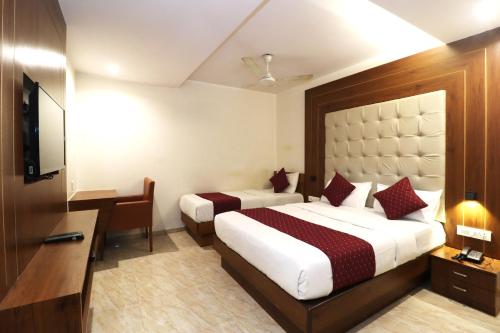 Postel nebo postele na pokoji v ubytování GATEWAY STAR HOTEL
