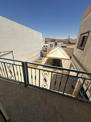 a balcony with a railing on top of a building at Nice studio in a good location in Bin Rhilouf
