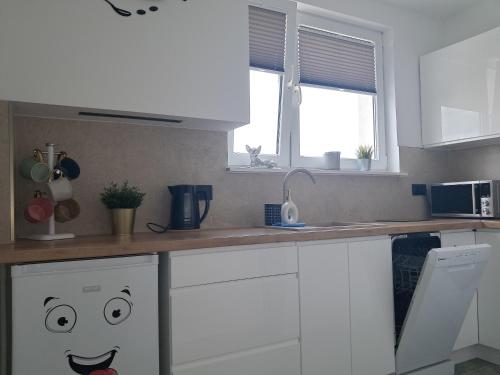 Η κουζίνα ή μικρή κουζίνα στο Twój Apartament Centrum 5 min od Zamku Krzyżackiego