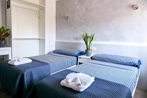 Postel nebo postele na pokoji v ubytování V Pension & Suites