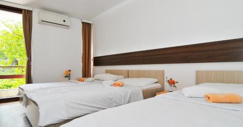 מיטה או מיטות בחדר ב-Hotel Kamelija
