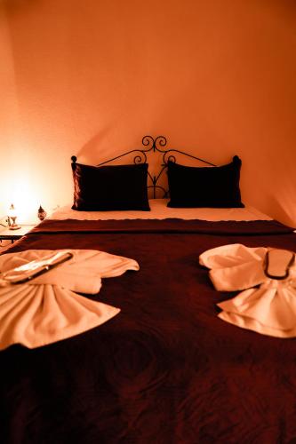 a bedroom with a large bed with two pillows at Ayaz Stone House in Goreme
