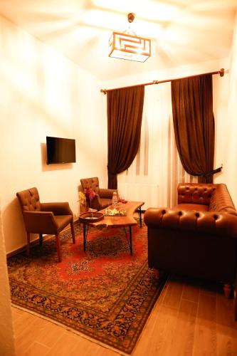 a living room with two couches and a table at Ayaz Stone House in Goreme