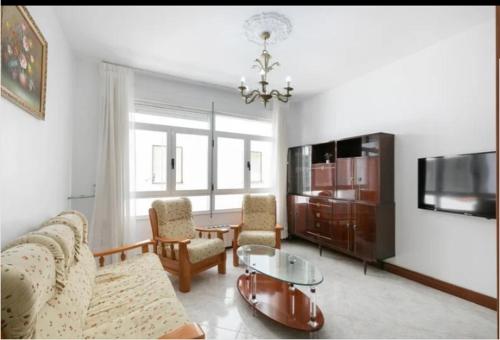 Televisyen dan/atau pusat hiburan di Apartamento Delfina