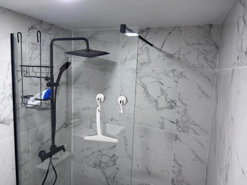 a bathroom with a shower with a glass door at Casa Rox in Villamartin