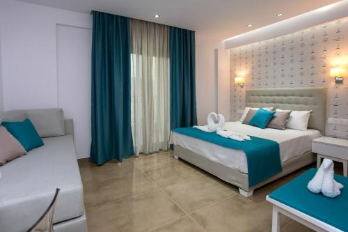 a hotel room with a bed and a desk at Patiras Deluxe B&B in Limenaria