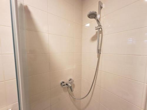 a shower with a glass door in a bathroom at Medulić Palace Rooms & Apartments 2 in Šibenik