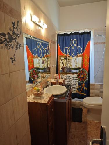 a bathroom with a sink and a toilet at Efi's Studio - Marathon in Marathón