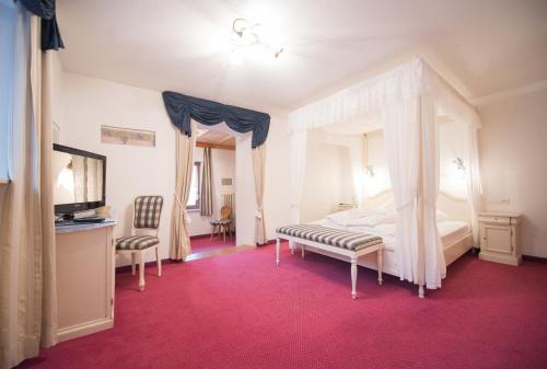 Ein Bett oder Betten in einem Zimmer der Unterkunft Die Post am Ortler