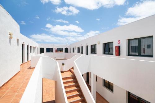 a view from the second floor of a building at Apartamentos Bella Vista - Africa in Puerto del Carmen