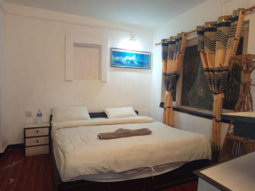 Giường trong phòng chung tại Nirvana Green Peace Home