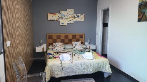Cama o camas de una habitación en Appartamenti Addimuru