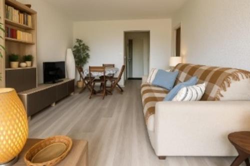 a living room with a couch and a table at Apartment for 6 with garden near beach in Bandol
