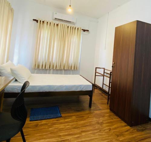 Ένα ή περισσότερα κρεβάτια σε δωμάτιο στο Pearl House