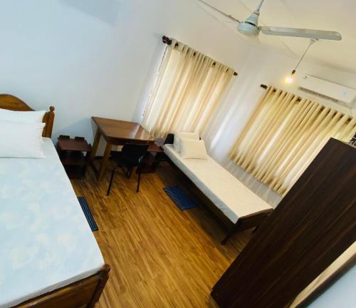 Ένα ή περισσότερα κρεβάτια σε δωμάτιο στο Pearl House