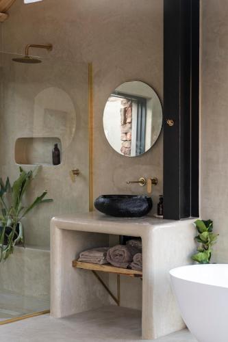 a bathroom with a sink and a mirror at Ashanté Boutique Retreat in Clanwilliam