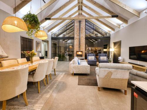 a living room with a dining table and chairs at 62 on Adderley in George