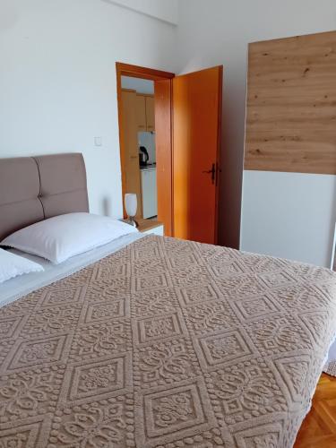 Posteľ alebo postele v izbe v ubytovaní Apartmani Zokić