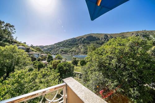 a view of a river from the balcony of a house at Refúgio entre o Pomar e o Rio Douro in Raiva