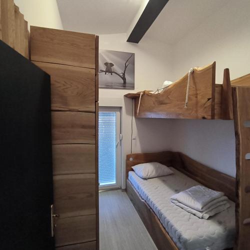 a small room with a bunk bed and a bunk bedessen at Vila PURA MAYA in Vir
