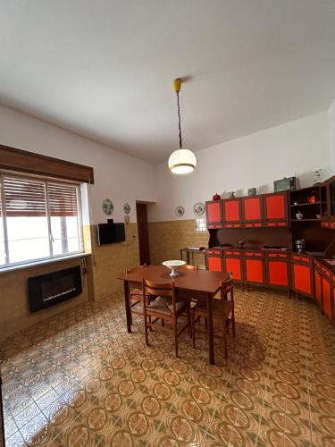 a room with a table and a dining room at Villa Sole in Randazzo