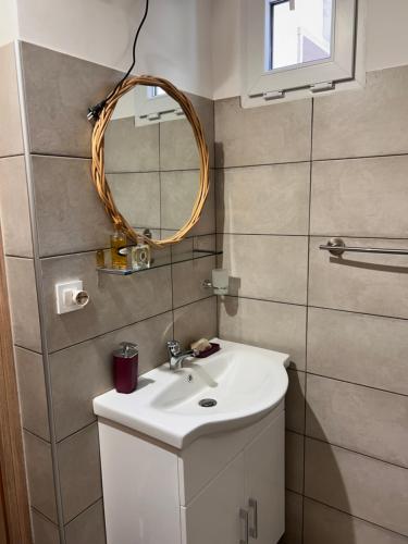 a bathroom with a sink and a mirror at Villa Sole in Randazzo