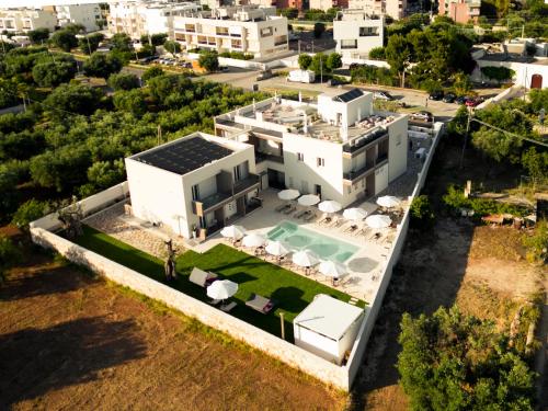 an aerial view of a house with a swimming pool at Eleia Domos in Monopoli