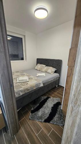Postel nebo postele na pokoji v ubytování Apartman Mima