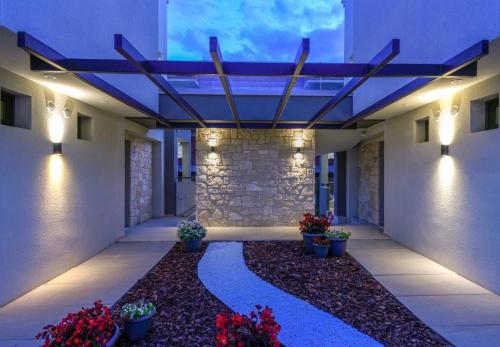 a hallway of a building with a stone wall at Marthina Luxury Living in Nea Potidaea