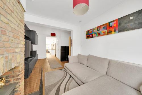 Un lugar para sentarse en GuestReady - Fabulous home with patio in Cann Hall