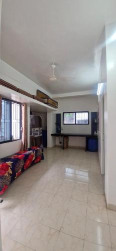 a large living room with a large tile floor at Swarajya Homestay in Aurangabad
