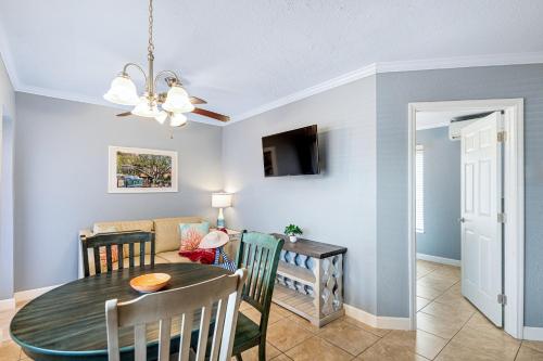 a dining room and living room with a table at Tropical Beach Resorts - Sarasota in Sarasota