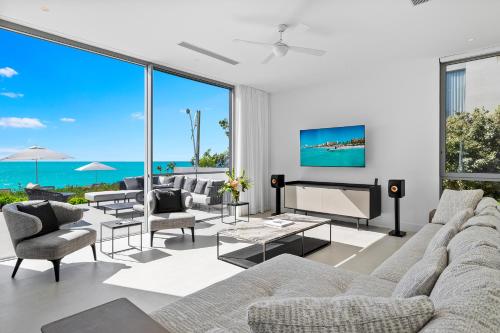 a living room with a view of the ocean at South Bank in Long Bay Hills