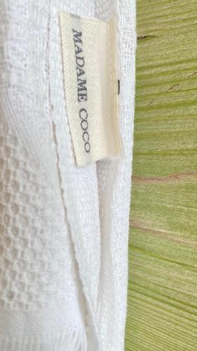 a close up of a white curtain on a bed at Akdeniz Villa in Kas