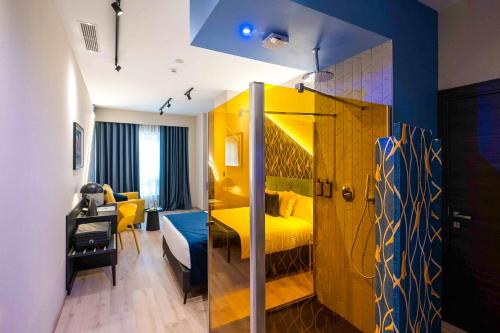 Postel nebo postele na pokoji v ubytování Hotel Pathos by Mimood Aparthotels