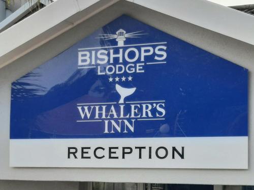 a sign for a bichros lodge whiskers in reception at Bishops Lodge in Gqeberha