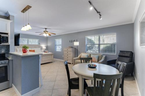 a kitchen and living room with a table and chairs at Tropical Beach Resorts - Sarasota in Sarasota