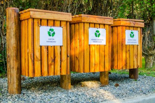 a couple of wooden boxes with signs on them at Kau Yatún Hotel Boutique in El Calafate