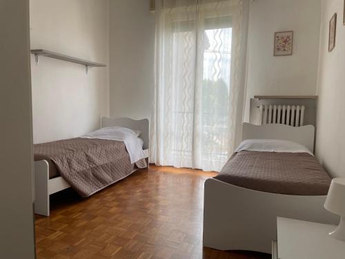 Postel nebo postele na pokoji v ubytování La Casa Nel Verde