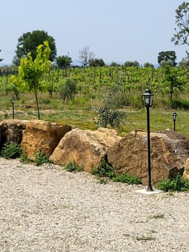 a street light next to some large rocks at VioVillas Agriturismo Glamping Arezzo in Arezzo