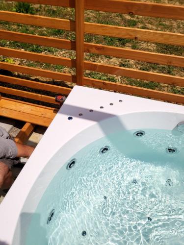 a jacuzzi tub on top of a deck at VioVillas Agriturismo Glamping Arezzo in Arezzo