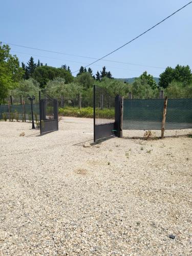 a group of gates on a dirt field at VioVillas Agriturismo Glamping Arezzo in Arezzo