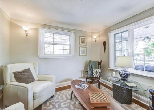 a living room with a couch and a table at Matisse B&B in Niagara on the Lake