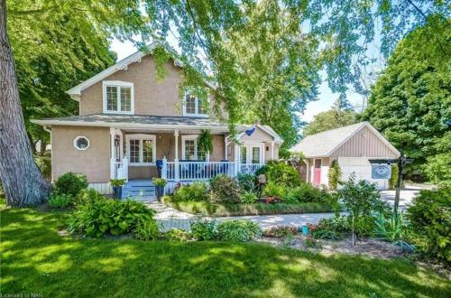 a home with a large yard with a house at Matisse B&B in Niagara on the Lake
