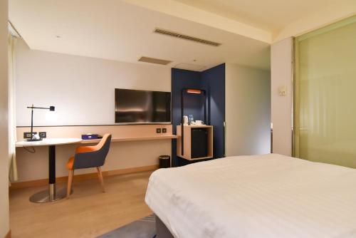 Holiday Inn Express Taipei Train Station by IHGにあるベッド