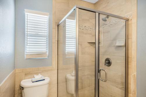 a bathroom with a shower and a toilet at Tropical Beach Resorts - Sarasota in Sarasota