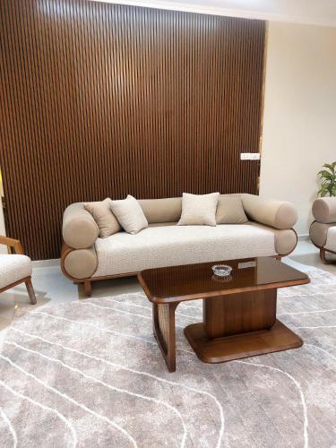 a living room with a couch and a coffee table at Luxury Apartment Near Mall of Arabia in 6th October Family only شقة فاخرة للايجار بجوار مول العرب فقط للعائلات in 6th Of October
