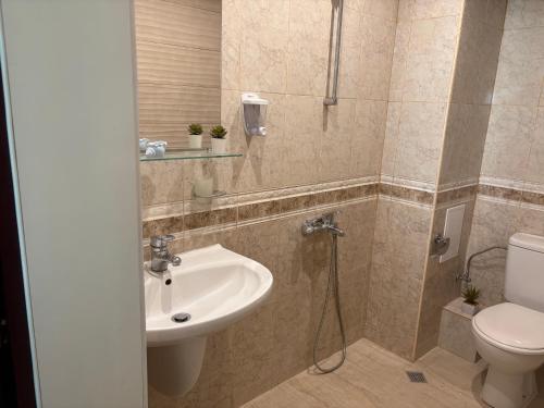 a bathroom with a sink and a toilet at Miramar palace 615S in Sunny Beach