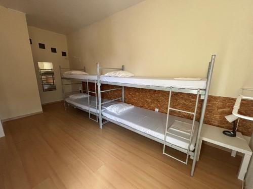 Postel nebo postele na pokoji v ubytování Garden Hostel